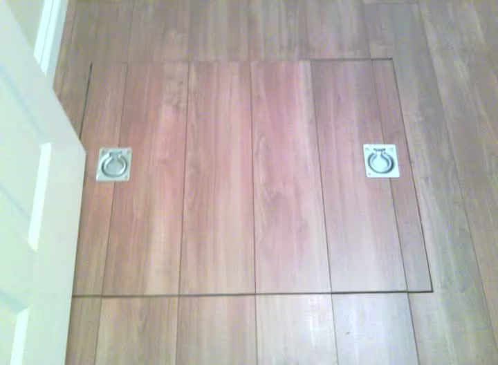 Wooden floor trapdoor with two metal ring pulls